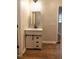 Bathroom featuring a vanity with black hardware and laminate wood floors at 6 1St St, Franklinton, NC 27525