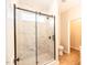 Beautiful walk-in shower featuring gray marble-look tile and glass door at 6 1St St, Franklinton, NC 27525