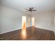 Spacious bedroom featuring hardwood floors, ceiling fan, and multiple entryways at 6 1St St, Franklinton, NC 27525