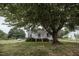 Charming home with lush green lawn and large shade tree at 6 1St St, Franklinton, NC 27525
