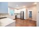 Bright kitchen featuring white cabinets, stainless steel appliances, and hardwood floors at 6 1St St, Franklinton, NC 27525