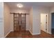 Charming living room with sliding wood and glass doors and gleaming hardwood floors at 6 1St St, Franklinton, NC 27525
