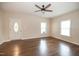 Inviting living room with hardwood floors, two large windows, and a front door entrance at 6 1St St, Franklinton, NC 27525