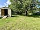 Shed with open door in the backyard, offering ample storage space for all your tools and equipment at 6 First St, Franklinton, NC 27525