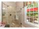 Bathroom featuring a glass-enclosed shower and stylish tile work at 605 Bear Tree Crk, Chapel Hill, NC 27517