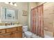 Cozy bathroom featuring granite countertops and a tub-shower combo at 605 Bear Tree Crk, Chapel Hill, NC 27517