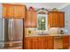 Charming kitchen featuring granite countertops, stainless steel appliances, and stylish wooden cabinets at 605 Bear Tree Crk, Chapel Hill, NC 27517