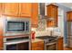 Chef's kitchen featuring stainless steel appliances and a modern backsplash at 605 Bear Tree Crk, Chapel Hill, NC 27517