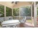 Relaxing screened-in porch with plush seating offering peaceful views of surrounding trees at 605 Bear Tree Crk, Chapel Hill, NC 27517