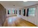 Spacious living room with hardwood floors, natural light, and neutral paint color at 623 Chambers Rd, Rougemont, NC 27572