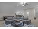 Spacious finished basement with a large sectional couch, wet bar, and pool table at 6648 Mafolie Ct, Raleigh, NC 27613