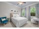 Serene bedroom with neutral tones, natural light, and stylish accents creating a cozy and inviting space at 6648 Mafolie Ct, Raleigh, NC 27613