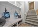 Functional mudroom with a built-in bench, storage cubbies, and access to the staircase at 6648 Mafolie Ct, Raleigh, NC 27613