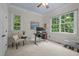 Bright home office with dual monitors, natural light and comfortable workspace at 6648 Mafolie Ct, Raleigh, NC 27613