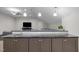 Stylish wet bar featuring granite countertops, pendant lighting, and sleek cabinets at 6648 Mafolie Ct, Raleigh, NC 27613