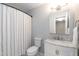 Updated bathroom featuring a marble vanity top, tub/shower combo, and neutral paint at 6685 English Ivy Ln, Raleigh, NC 27615