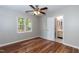 Bedroom with hardwood floors, neutral paint, and access to an ensuite bathroom at 6685 English Ivy Ln, Raleigh, NC 27615