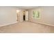 Serene bedroom with carpet flooring, closet, and natural light from the window at 6685 English Ivy Ln, Raleigh, NC 27615