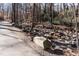 Scenic creek side paved walking trail surrounded by natural beauty at 6685 English Ivy Ln, Raleigh, NC 27615