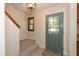 Welcoming foyer with a decorative door and staircase at 6685 English Ivy Ln, Raleigh, NC 27615