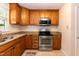 Updated kitchen with granite counters, stainless appliances and wood cabinetry at 6685 English Ivy Ln, Raleigh, NC 27615