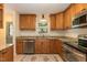 Bright kitchen with stainless steel appliances, granite countertops, and ample cabinetry at 6685 English Ivy Ln, Raleigh, NC 27615