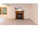 Inviting living room featuring a fireplace and large windows for natural light at 6685 English Ivy Ln, Raleigh, NC 27615