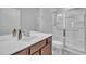 Bright bathroom featuring a glass door shower, white vanity, and modern fixtures at 804 Harsworth Dr, Cary, NC 27519