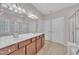 Elegant bathroom with a double sink vanity, soaking tub, and a glass-enclosed shower at 804 Harsworth Dr, Cary, NC 27519