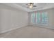 Spacious bedroom with neutral carpet and an abundance of natural light through large, bright windows at 804 Harsworth Dr, Cary, NC 27519