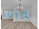 Bright dining area with modern chandelier and large windows offering ample natural light and an open space concept at 804 Harsworth Dr, Cary, NC 27519