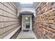 Stylish entrance features stone and wood siding, a skylight, and a secure front door at 804 Harsworth Dr, Cary, NC 27519