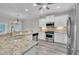 Open concept kitchen with stainless appliances, granite countertops and island with sink and seating space at 804 Harsworth Dr, Cary, NC 27519