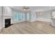 Bright living space featuring modern floors, a fireplace, and large windows for natural light at 804 Harsworth Dr, Cary, NC 27519