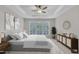Bright main bedroom with tray ceiling, large windows, and stylish furnishings for a relaxing retreat at 804 Harsworth Dr, Cary, NC 27519