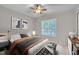 Beautiful main bedroom featuring a tray ceiling and large window with privacy shutters at 804 Harsworth Dr, Cary, NC 27519