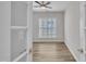 Bright, light-filled room with neutral paint, a ceiling fan, and a large window looking out onto the property at 804 Harsworth Dr, Cary, NC 27519