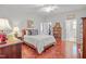 Bright bedroom with ceiling fan, hardwood floors, and decoratively furnished at 826 Rushing, Pittsboro, NC 27312