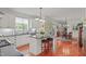 Modern kitchen with white cabinets, granite countertops, island and view to the breakfast room at 826 Rushing, Pittsboro, NC 27312