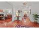 View of the living room with a fireplace, leather furniture, and hardwood floors at 826 Rushing, Pittsboro, NC 27312