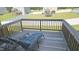 Spacious deck with outdoor furniture, overlooking a large, fenced backyard at 904 Romeria Dr, Durham, NC 27713