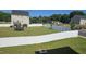 Expansive fenced backyard with a lush lawn, surrounded by mature trees at 904 Romeria Dr, Durham, NC 27713