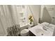 The bathroom includes tub-shower combo, decorated curtain, toilet with decor, and a vanity sink at 904 Romeria Dr, Durham, NC 27713