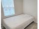 Bedroom showcases a window with white blinds that bathes the room in natural light at 904 Romeria Dr, Durham, NC 27713