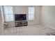 Bright, carpeted bedroom featuring two windows and space for furniture arrangement at 904 Romeria Dr, Durham, NC 27713