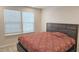 Bedroom featuring a large bed, neutral walls, and ample natural light from the window at 904 Romeria Dr, Durham, NC 27713