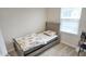 Bedroom featuring a twin bed with a floral comforter, and a window with natural light at 904 Romeria Dr, Durham, NC 27713