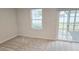 Bedroom with carpet, sliding glass doors to backyard, and window with blinds at 904 Romeria Dr, Durham, NC 27713