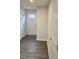 A clean entryway with light-colored walls, vinyl floors, and a front door with glass panels at 904 Romeria Dr, Durham, NC 27713