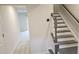 Inviting entryway with hardwood floors, stairs with gray wood steps, and neutral paint at 904 Romeria Dr, Durham, NC 27713